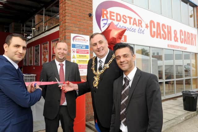From left, Redstar's director Ramazan Yilmaz, branch manager Carl Jackson, Lord Mayor of Portsmouth David Fuller and operations manager Harj Sunder Picture: Sarah Standing (161478-5892)