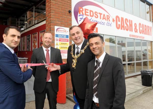 From left, Redstar's director Ramazan Yilmaz, branch manager Carl Jackson, Lord Mayor of Portsmouth David Fuller and operations manager Harj Sunder Picture: Sarah Standing (161478-5892)