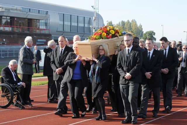 Orien Young's coffin is taken down the 100m track at the Mountbatten Centre before his funeral service Picture: Sarah Standing (161479-9341)