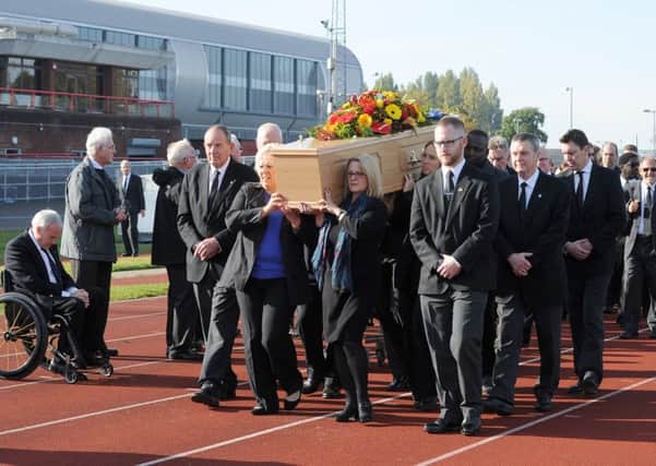 Orien Young's coffin is taken down the 100m track at the Mountbatten Centre before his funeral service Picture: Sarah Standing (161479-9341)