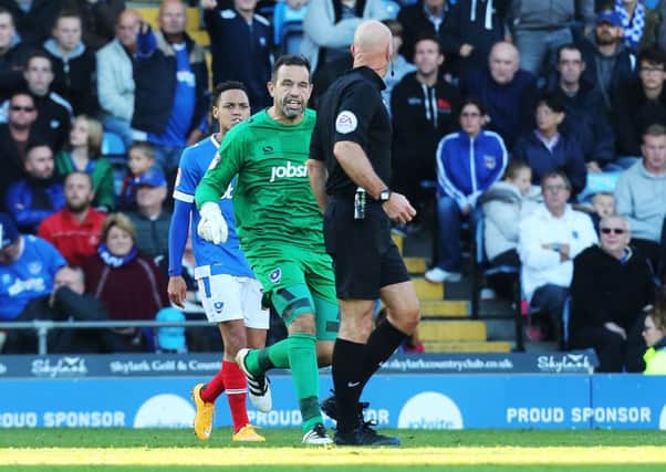 Pompey keeper David Forde confronts referee Nigel Miller. Picture: Joe Pepler