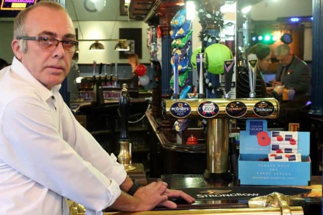 Andy Lilly of the Park Tavern, who says he is disgusted that a Poppy Appeal charity box has been stolen from his pub Picture: UKNIP