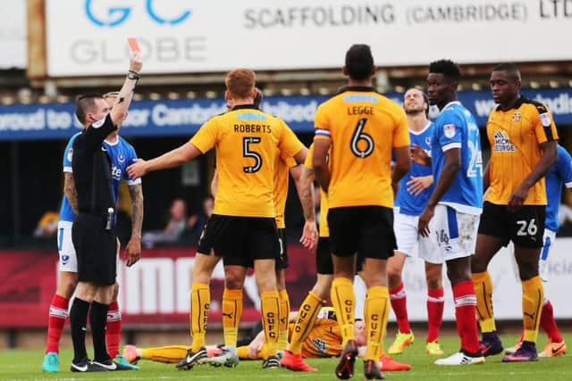 Pompey midfielder Amine Linganzi saw red for a two-footed challenge in the second half - but the Blues held firm to earn a vital three-point haul Picture: Joe Pepler