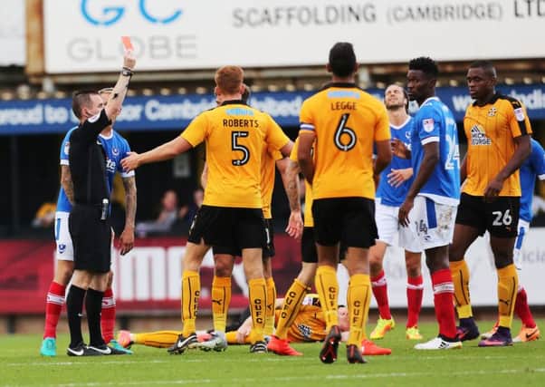 Pompey midfielder Amine Linganzi saw red for a two-footed challenge in the second half - but the Blues held firm to earn a vital three-point haul   Picture: Joe Pepler