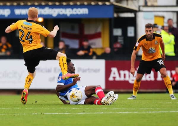 Amine Linganzi saw red for lunging into a 61st-minute tackle with Cambridge subsitute Conor Newton in yesterday's 1-0 win at the U's   Picture: Joe Pepler