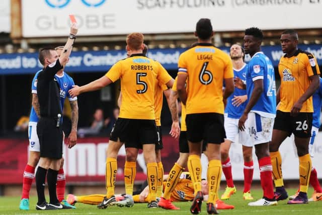 Amine Linganzi picks up a red card from referee Ross Joyce Picture: Joe Pepler
