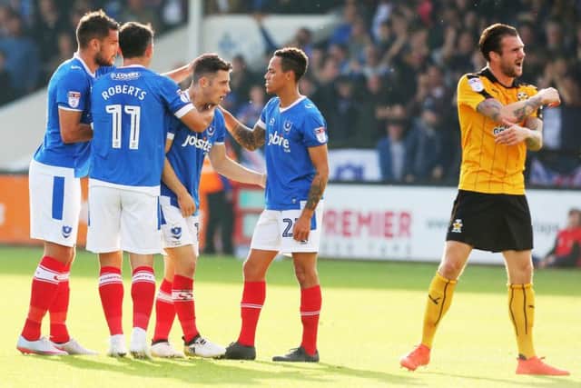 Pompey celebrate Conor Chaplin's decisive goal. Pictures: Joe Pepler