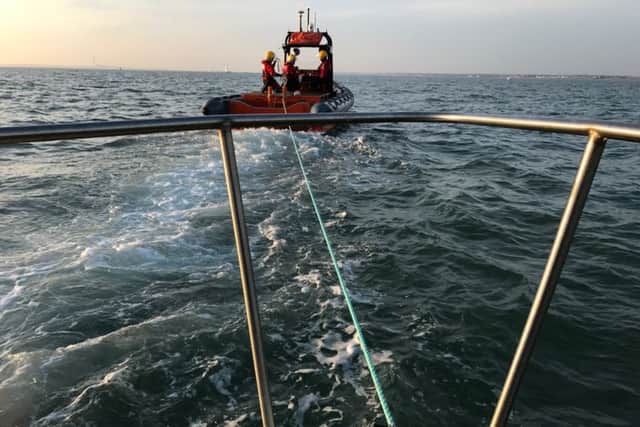 A GAFIRS lifeboat tows a stranded fishing boat to safety. Picture: GAFIRS