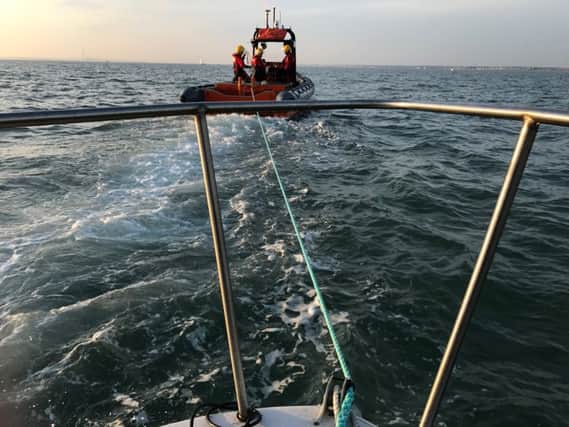 A GAFIRS lifeboat tows a stranded fishing boat to safety. Picture: GAFIRS