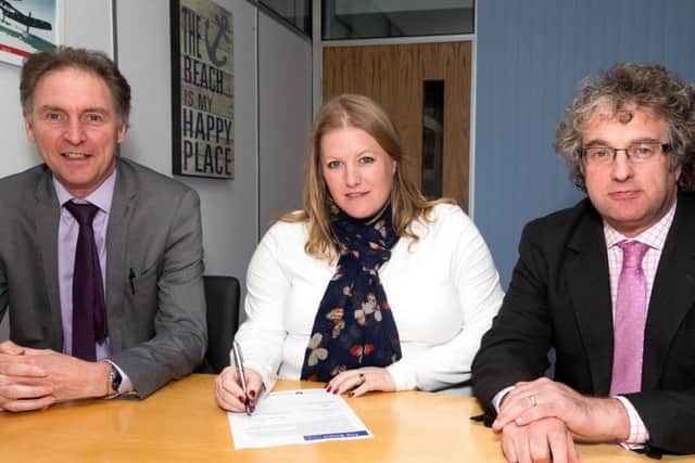 Solent leaders sign a letter as part of the bid to become a combined authority, from left, Southampton City Council leader Simon Letts, Portsmouth City Council leader Donna Jones and Isle of Wight council leader Jonathan Bacon