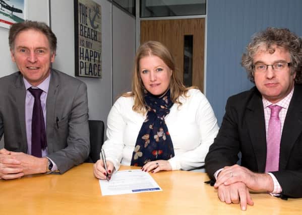 Solent leaders sign a letter as part of the bid to become a combined authority, from left, Southampton City Council leader Simon Letts, Portsmouth City Council leader Donna Jones and Isle of Wight council leader Jonathan Bacon