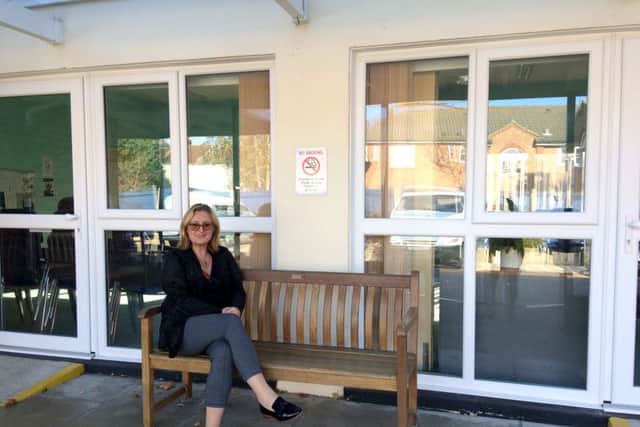 Lynne Rigby outside Southsea community centre which now has new windows and a new boiler thanks to Veolia