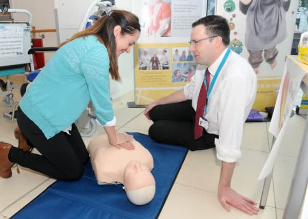 Sarah Conway from Unison learning how to give CPR with Carl Davies, resuscitation officer at Queen Alexandra Hospital 

Picture: Sarah Standing (161419-4984)