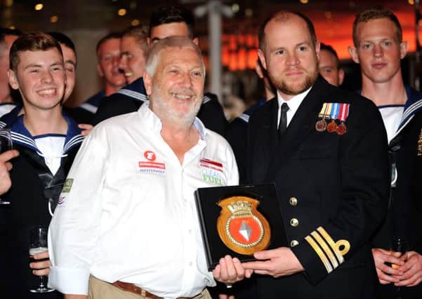 Alan Priddy with sailors from HMS Diamond and the shield