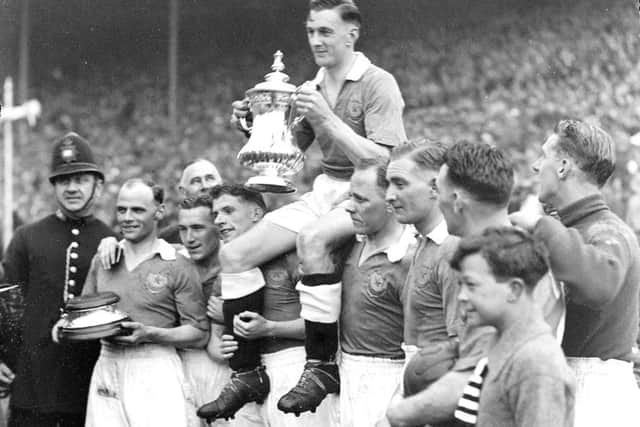 Pompey's 1939 FA Cup winning-captain Jimmy Guthrie being carried by his Blues team-mates