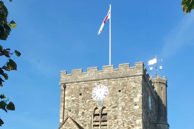 The Easter Cross flag flag flying from the flagpole at St Faiths Church, Havant