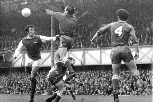 John Milkins challenges Ray Kennedy whilst Fred Smith and Eoin Hand look on. Picture: Pompey History Society Archive