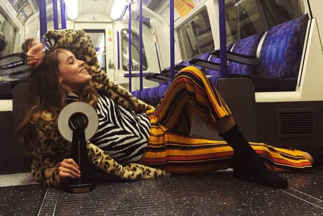 Jerry Williams celebrating on the London Underground after winning the Unsigned Music Award 2016 for Best Produced/Engineered Record for her recent EP, Let's Just Forget It