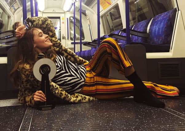 Jerry Williams celebrating on the London Underground after winning the Unsigned Music Award 2016 for Best Produced/Engineered Record for her recent EP, Let's Just Forget It