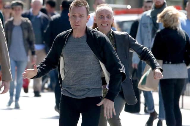 Actors Ewan McGregor (front) and Ewan Bremner (behind) running through the streets of Edinburgh where scenes for the new Trainspotting 2 is being filmed.