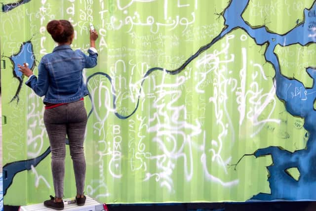 A participant in the shipping container art project. Picture: Paul Gonella/Strong Island