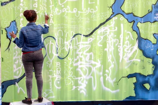 A participant in the shipping container art project.
Picture: Paul Gonella/Strong Island