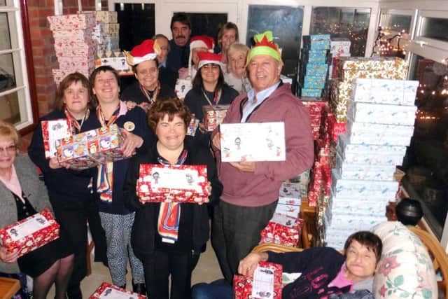 Malcolm Dent with the Trefoilers who made Christmas shoe boxes