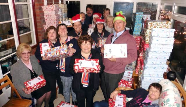 Malcolm Dent with the Trefoilers who made Christmas shoe boxes