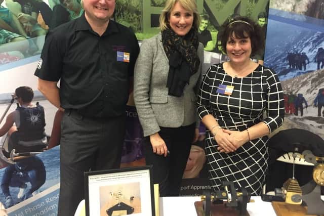 KNOWLEDGE Caroline Dinenage, centre, with Defence Munitions at the employment fair in January
