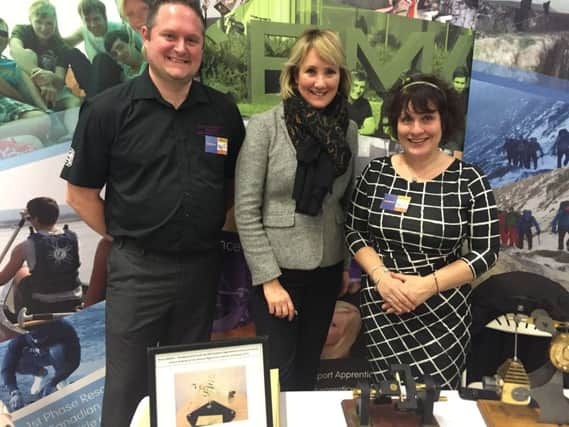 KNOWLEDGE Caroline Dinenage, centre, with Defence Munitions at the employment fair in January