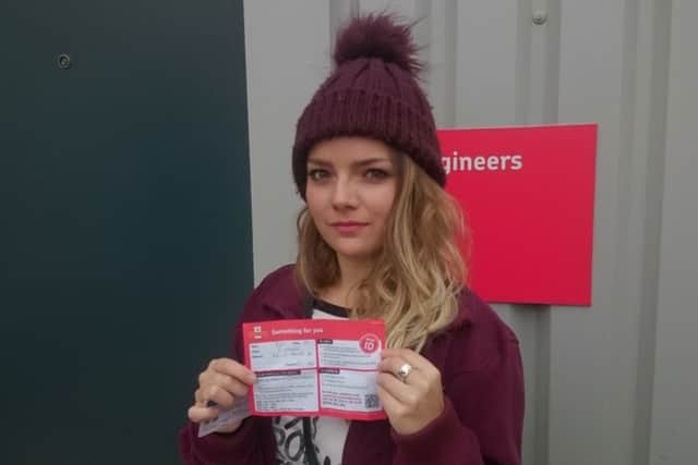 Courtney Moore waiting for a parcel at the new Royal Mail delivery hub
