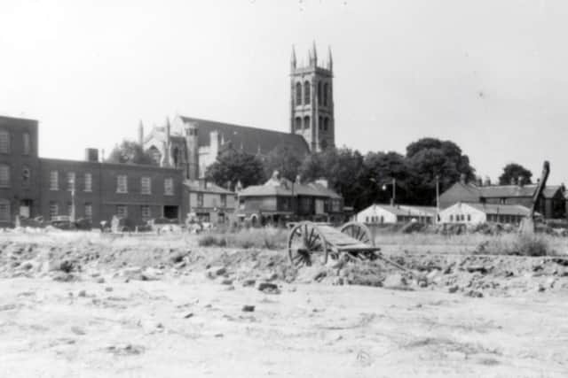 THEN The parish church of St Marys, Portsea, seen from the Manor Road/Cowper Road junction in 1961. The wasteland was The site of St Marys Road School for Girls. 								 Picture: Eddie Wallace