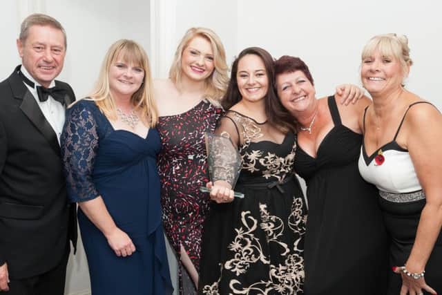 The team from Woodland Court with thier Compassion and Caring award, which was presented by Mike and Debbie Watts,directors of Solent Mobility, first left and far right Picture: Keith Woodland