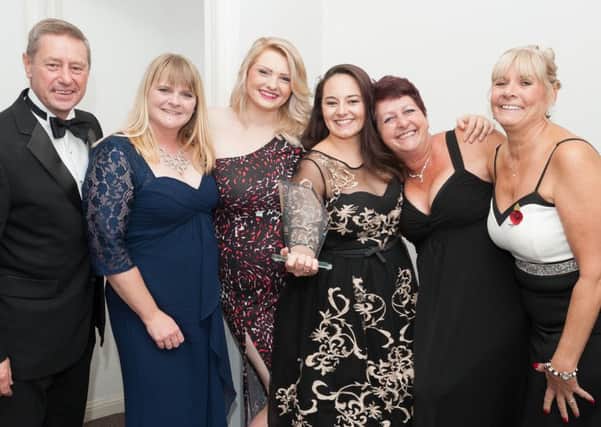 The team from Woodland Court with thier Compassion and Caring award, which was presented by Mike and Debbie Watts,directors of Solent Mobility, first left and far right Picture: Keith Woodland