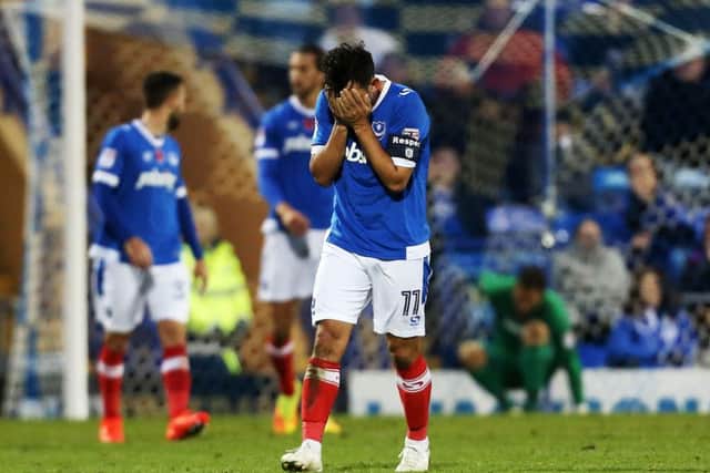 Gary Roberts cannot bear to look as Pompey are knocked out of the FA Cup by Wycombe Picture: Joe Pepler