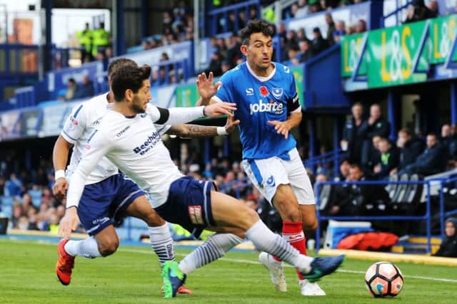 Gary Roberts is stopped in his tracks during Pompey's FA Cup defeat to Wycombe at Fratton Park Picture: Joe Pepler