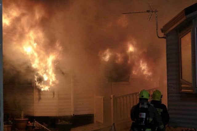 Firefighters battling a caravan fire on Hayling Island (picture courtesy of @HaylingFire21) PPP-160711-072018001