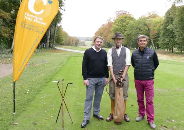 Chestnut Tree House chief executive Hugh Lowson, and Stuart Gillett, from Goodwood, with club professional Chris McDonnell dressed as course designer James Braid