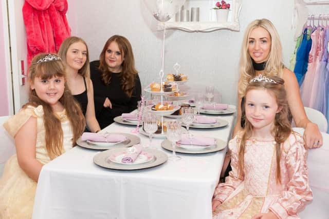 From left, Holly Williams, seven, Emma Sturdess, Laura Williams, Jenna Cook and Taylor-Belle Legg, seven, around the table where the children pamper parties will be held Picture: Keith Woodland (161488-014)