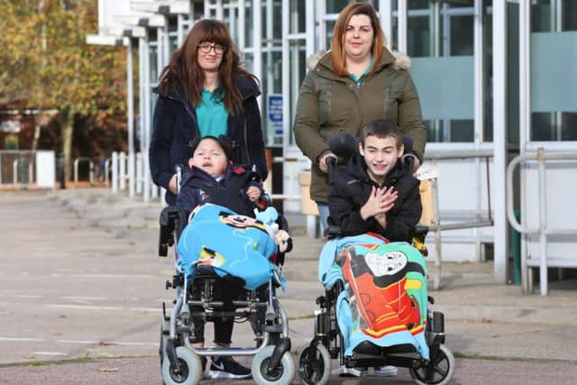 Carers Victoria Wills and Martina Urry with Braden McDowell, eight, and his brother Travis, 12. Picture: Habibur Rahman (161521-35)