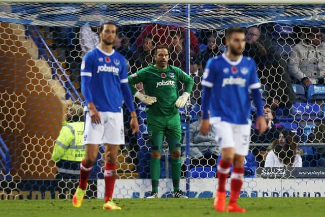 Christian Burgess, David Forde and Ben Close look dejected follwing the Cup defeat against Wycombe Picture: Joe Pepler