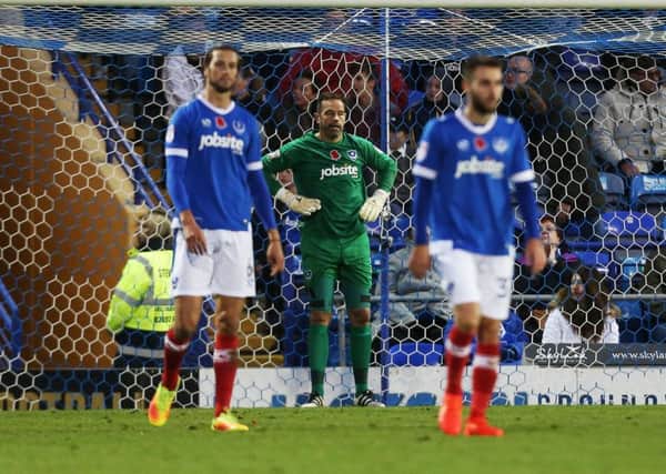 Christian Burgess, David Forde and Ben Close look dejected follwing the Cup defeat against Wycombe Picture: Joe Pepler