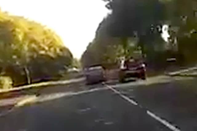 The Mercedes and the Porsche on the wrong side of Holbrook Road in Portsmouth, as captured by motorcyclist Perry Grant's headcam