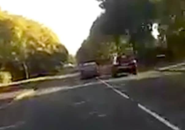 The Mercedes and the Porsche on the wrong side of Holbrook Road in Portsmouth, as captured by motorcyclist Perry Grant's headcam