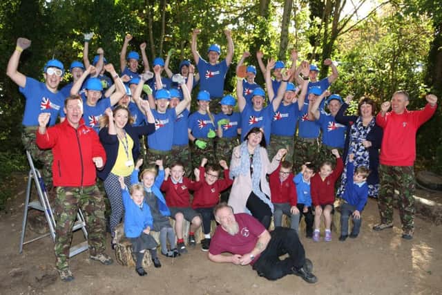 Military Mentors at Crofton Anne Dale School with Year 1 and Year 2 pupils with Lorraine Phillips, executive head teacher in the middle and site manager, Dave Mann at the front Picture: Habibur Rahman (161516-69)