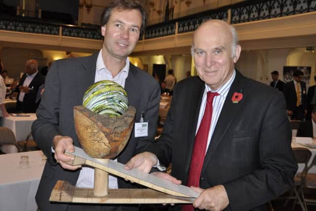Future South board member Andy Stanford-Clark holds the David Green Award trophy with Sir Vince Cable