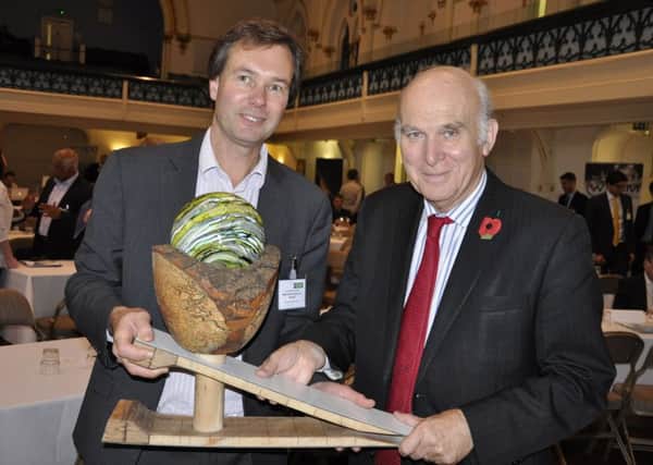 Future South board member Andy Stanford-Clark holds the David Green Award trophy with Sir Vince Cable
