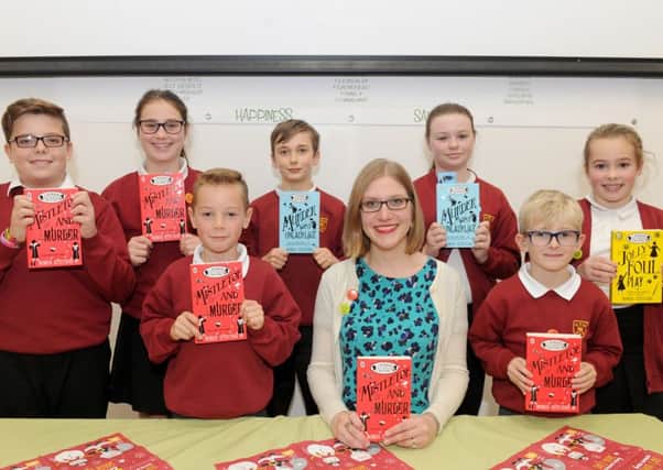 Author Robin Stevens with, from left, Liam Timberlake, Ella Spacey, Daniel Porton, Rhys Jenkins, Keira Colwell, Toby Goodhew and Ella Jenner 

Picture: Sarah Standing (161512-1291)