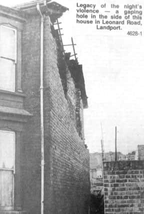 Legacy of the night's violence - a gaping hole in the side of this house in Leonard Road, Landport.