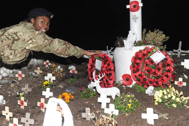 Lance Corporal Paloma Thukani lays a wreath at the Portsmouth Combined Cadet Force remembrance servicePicture: Sarah Standing (161513-1326)